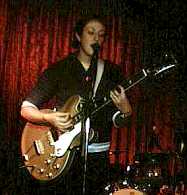 Jen Turrell with guitar